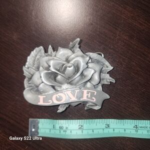 Y2K Love and a dagger belt buckle